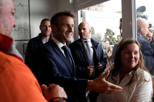 french-president-emmanuel-macron-arrives-in-a-cafe-after-a-military-ceremony-tuesday-june-18-2024-on-the-ile-de-sein-brittany-the-early-legislative-vote-june-30-and-july-7-was-triggered-by-emmanu