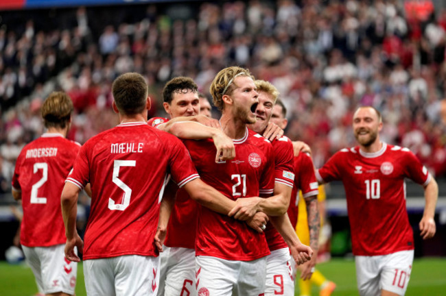 denmarks-morten-hjulmand-center-celebrates-with-teammates-after-scoring-his-sides-first-goal-during-a-group-c-match-between-denmark-and-england-at-the-euro-2024-soccer-tournament-in-frankfurt-germ