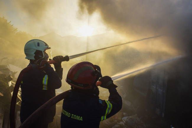 athens-greece-19-june-2024-firefighters-attempt-to-extinguish-a-fire-amidst-thick-smoke-that-has-broke-out-in-a-factory-area-during-a-wildfire-in-the-eastern-suburbs-of-the-greek-capital-authoriti