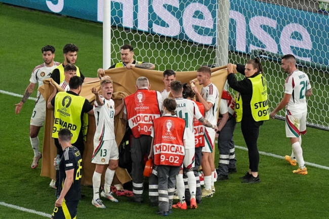 hungary-players-and-staff-cover-barnabas-varga-after-an-injury-during-a-group-a-match-between-scotland-and-hungary-at-the-euro-2024-soccer-tournament-in-stuttgart-germany-sunday-june-23-2024-ap