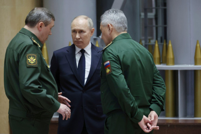 file-russian-president-vladimir-putin-center-talks-with-russian-chief-of-general-staff-gen-valery-gerasimov-left-and-russian-defense-minister-sergei-shoigu-after-a-meeting-with-military-leaders