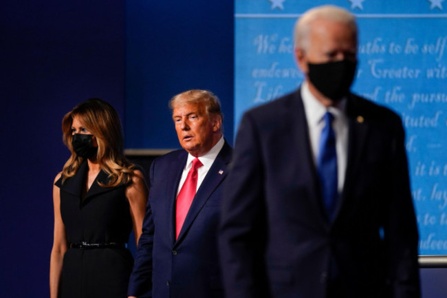 first-lady-melania-trump-left-and-president-donald-trump-center-remain-on-stage-as-democratic-presidential-candidate-former-vice-president-joe-biden-right-walks-away-at-the-conclusion-of-the-sec