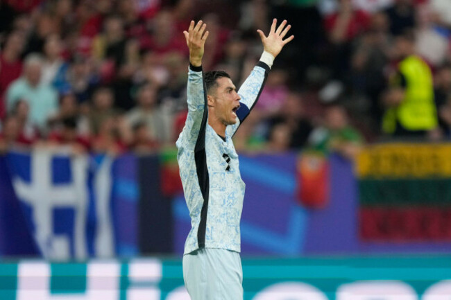 portugals-cristiano-ronaldo-pleads-his-case-for-a-foul-during-a-group-f-match-between-georgia-and-portugal-at-the-euro-2024-soccer-tournament-in-gelsenkirchen-germany-wednesday-june-26-2024-ap
