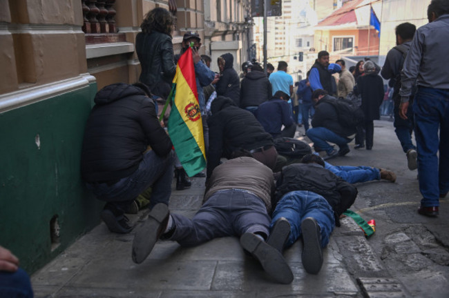 la-paz-bolivia-26th-june-2024-supporters-of-bolivian-president-arce-seek-cover-from-tear-gas-near-the-government-palace-during-an-attempted-coup-we-condemn-the-irregular-mobilizations-of-some-un