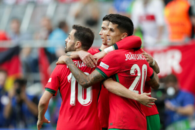 dortmund-germany-22nd-june-2024-bernardo-silva-of-portugal-l-cristiano-ronaldo-of-portugal-c-and-joao-cancelo-p-celebrate-after-scoring-a-goal-during-the-uefa-euro-2024-final-match-between