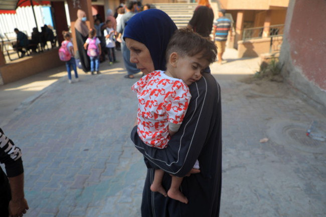 gaza-27th-june-2024-a-woman-holds-a-child-with-cancer-waiting-to-leave-for-treatment-abroad-at-the-nasser-medical-hospital-in-the-southern-gaza-strip-city-of-khan-younis-on-june-27-2024-twenty-o