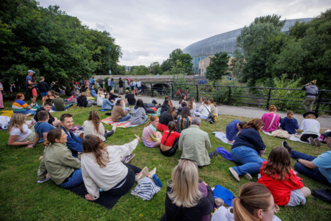 editorial-use-only-taylor-swift-fans-outside-the-aviva-stadium-in-dublin-listen-to-taylor-performing-during-the-eras-tour-picture-date-friday-june-28-2024