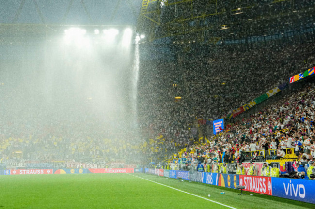 heavy-rain-falls-as-play-is-suspended-during-a-round-of-sixteen-match-between-germany-and-denmark-at-the-euro-2024-soccer-tournament-in-dortmund-germany-saturday-june-29-2024-ap-photoandreea-al