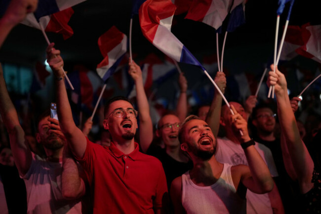 supporters-of-french-far-right-leader-marine-le-pen-react-after-the-release-of-projections-based-on-the-actual-vote-count-in-select-constituencies-sunday-june-30-2024-in-henin-beaumont-northern-f