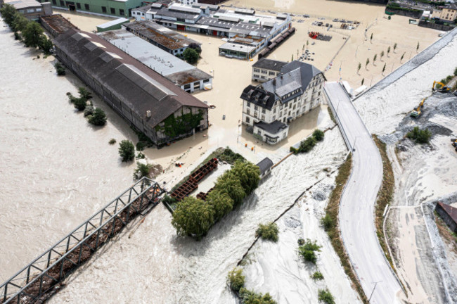 a-view-of-the-rhone-river-at-left-and-the-navizence-river-overflowing-in-the-industrial-zone-that-produces-aluminium-constellium-following-the-storms-that-caused-major-flooding-in-chippis-switz