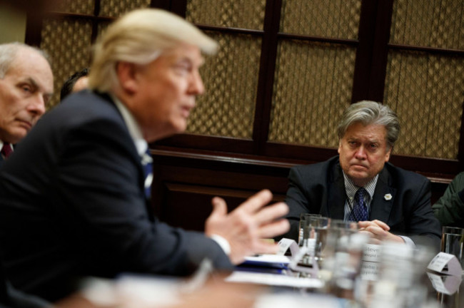 white-house-chief-strategist-steve-bannon-listens-at-right-as-president-donald-trump-speaks-during-a-meeting-on-cyber-security-in-the-roosevelt-room-of-the-white-house-in-washington-tuesday-jan-31