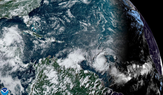 this-national-oceanic-and-atmospheric-administration-satellite-image-taken-at-420pm-edt-shows-hurricane-beryl-lower-center-right-as-it-strengthens-over-the-atlantic-ocean-and-churns-toward-the-sout