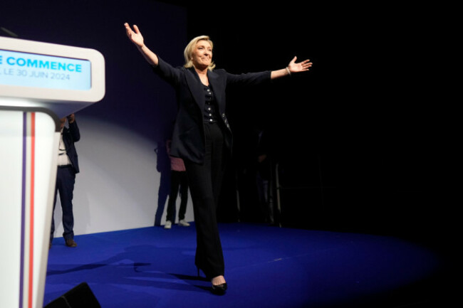 french-far-right-leader-marine-le-pen-gestures-after-delivering-her-speech-after-the-release-of-projections-based-on-the-actual-vote-count-in-select-constituencies-sunday-june-30-2024-in-henin-bea