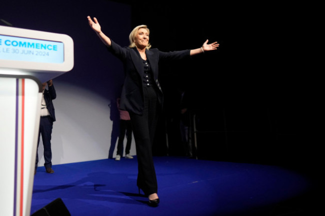 french-far-right-leader-marine-le-pen-gestures-after-delivering-her-speech-after-the-release-of-projections-based-on-the-actual-vote-count-in-select-constituencies-sunday-june-30-2024-in-henin-bea