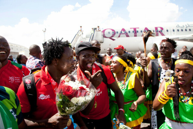 kenya-national-rugby-sevens-team-players-dance-with-kenyan-tribal-dancers-on-arrival-at-jomo-kenyatta-airport-nairobi-kenya-tuesday-april-19-2016-traditional-dancers-greeted-kenyas-winning-rugb