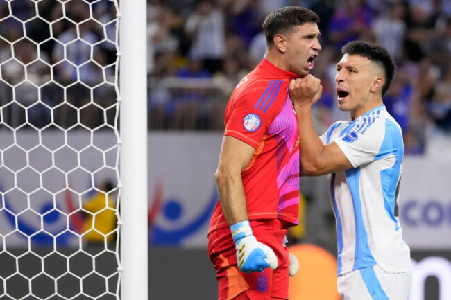 argentinas-goalkeeper-emiliano-martinez-left-and-lisandro-martinez-celebrate-after-ecuadors-enner-valencia-missed-a-penalty-during-a-copa-america-quarterfinal-soccer-match-in-houston-thursday-ju
