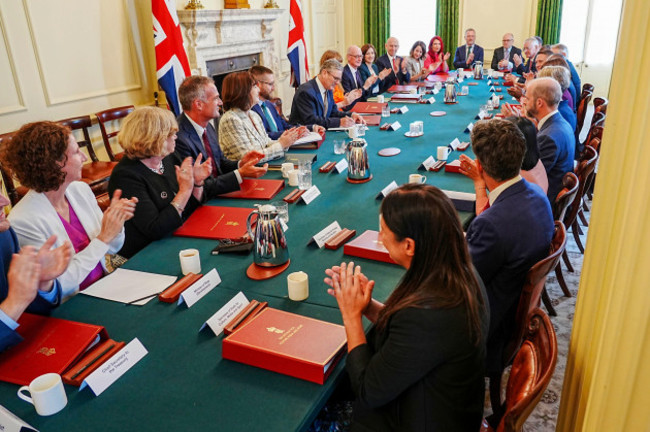 britains-prime-minister-keir-starmer-center-with-deputy-prime-minister-angela-rayner-center-right-hosts-his-first-cabinet-meeting-at-10-downing-street-london-saturday-july-6-2024-following-th