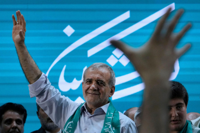 iranian-presidential-candidate-masoud-pezeshkian-waves-to-his-supporters-while-campaigning-in-tehran-iran-sunday-june-23-2024-ap-photovahid-salemi