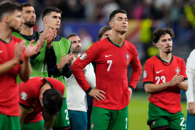 portugals-cristiano-ronaldo-center-reacts-at-the-end-of-a-quarter-final-match-against-france-at-the-euro-2024-soccer-tournament-in-hamburg-germany-friday-july-5-2024-ap-photohassan-ammar