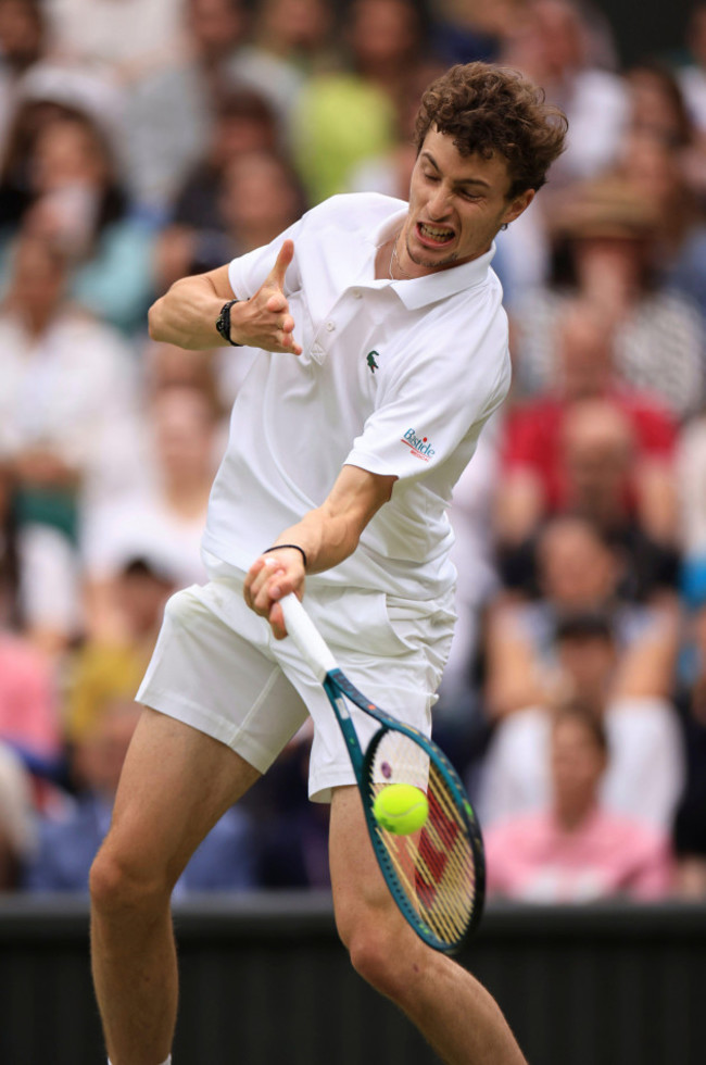 ugo-humbert-of-france-hits-a-ball-during-the-gentlemens-singles-4th-round-match-against-carlos-alcaraz-of-spain-on-the-day-7-of-the-wimbledon-tennis-championships-at-all-england-lawn-tennis-and-croqu