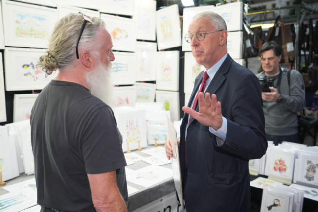 northern-ireland-secretary-hilary-benn-right-speaks-with-a-market-trader-during-a-visit-to-st-georges-market-in-belfast-following-the-labour-partys-victory-in-the-2024-general-election-picture-d