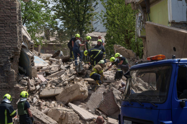 rescuers-work-at-a-site-of-a-destroyed-building-after-russias-missiles-attack-in-kyiv-ukraine-monday-july-8-2024-the-daytime-russian-barrage-targeted-five-ukrainian-cities-with-more-than-40-miss