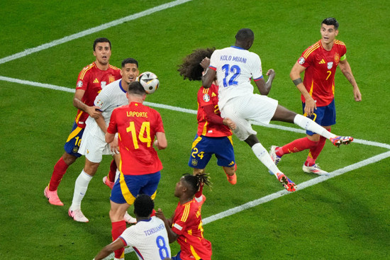 randal-kolo-muani-of-france-12-jumps-for-a-header-during-a-semifinal-match-between-spain-and-france-at-the-euro-2024-soccer-tournament-in-munich-germany-tuesday-july-9-2024-ap-photoebrahim-no