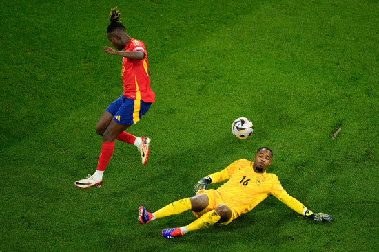 spains-nico-williams-jumps-over-france-goalkeeper-mike-maignan-during-a-semifinal-match-between-spain-and-france-at-the-euro-2024-soccer-tournament-in-munich-germany-tuesday-july-9-2024-ap-phot