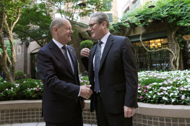 britains-prime-minister-keir-starmer-right-gestures-with-german-chancellor-olaf-scholz-for-a-bilateral-meeting-at-a-hotel-ahead-of-the-nato-summit-in-washington-wednesday-july-10-2024-stefan