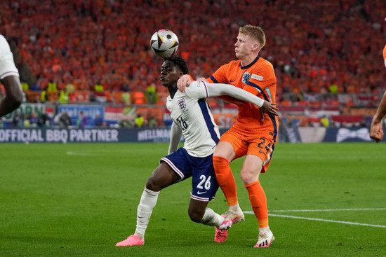 englands-kobbie-mainoo-left-and-jerdy-schouten-of-the-netherlands-battle-for-the-ball-during-a-semifinal-at-the-euro-2024-soccer-tournament-in-dortmund-germany-wednesday-july-10-2024-ap-photo