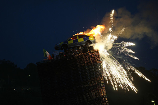 a-mock-police-car-isis-set-alight-on-top-of-a-bonfire-in-moygashel-near-dungannon-co-tyrone-the-burning-of-loyalist-bonfires-is-part-of-the-traditional-twelfth-commemorations-marking-the-anniversary