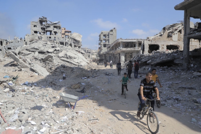 gaza-11th-july-2024-people-are-seen-on-a-street-with-destroyed-buildings-in-the-shujaiya-neighborhood-in-east-of-gaza-city-on-july-11-2024-more-than-60-bodies-were-recovered-from-the-rubble-in-t