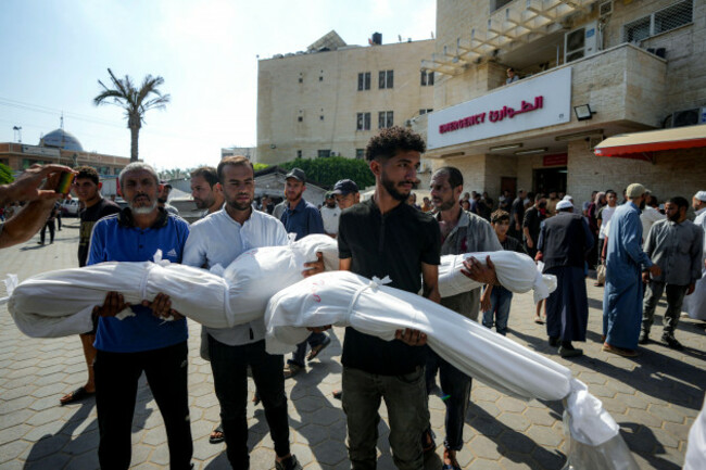 palestinians-hold-the-bodies-of-their-relatives-killed-in-the-israeli-bombardment-of-the-gaza-strip-at-a-hospital-in-deir-al-balah-saturday-july-13-2024-ap-photoabdel-kareem-hana