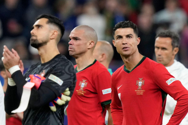 portugals-goalkeeper-diogo-costa-pepe-and-cristiano-ronaldo-from-left-react-after-losing-a-quarterfinal-match-between-portugal-and-france-at-the-euro-2024-soccer-tournament-in-hamburg-germany-fr