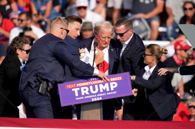 republican-presidential-candidate-former-president-donald-trump-is-helped-off-the-stage-at-a-campaign-event-in-butler-pa-on-saturday-july-13-2024-ap-photogene-j-puskar