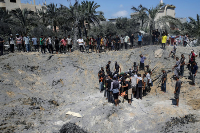 palestinians-search-for-bodies-and-survivors-in-a-site-hit-by-an-israeli-bombardment-on-khan-younis-southern-gaza-strip-saturday-july-13-2024-israel-said-it-targeted-hamas-shadowy-military-comma