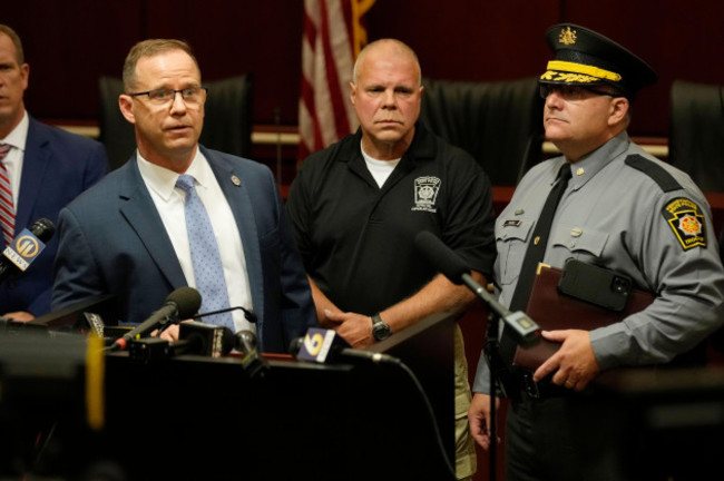 kevin-rojek-left-fbi-special-agent-in-charge-lt-col-george-givens-center-pennsylvania-state-police-and-col-christopher-paris-right-pennsylvania-state-police-answer-questions-at-a-news-conf