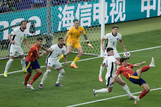 spains-robin-le-normand-right-and-englands-declan-rice-vie-for-the-ball-during-the-final-match-at-the-euro-2024-soccer-tournament-in-berlin-germany-sunday-july-14-2024-ap-photothanassis-sta