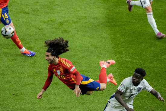 spains-marc-cucurella-left-and-englands-bukayo-saka-vie-for-the-ball-during-the-final-match-at-the-euro-2024-soccer-tournament-in-berlin-germany-sunday-july-14-2024-ap-photothanassis-stavra