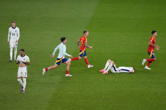 spains-players-celebrate-after-their-team-defeated-england-2-1-at-the-end-of-the-final-match-at-the-euro-2024-soccer-tournament-in-berlin-germany-sunday-july-14-2024-ap-photothanassis-stavraki