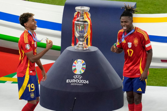 spains-lamine-yamal-left-and-nico-williams-celebrate-at-the-podium-during-the-final-match-against-england-at-the-euro-2024-soccer-tournament-in-berlin-germany-sunday-july-14-2024-spain-won-the