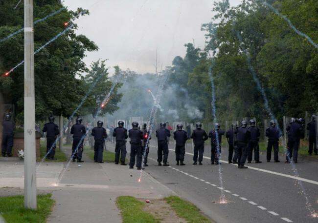 protesters-fire-fireworks-at-gardai-officers-during-a-stand-off-after-a-number-of-fires-have-been-started-at-the-former-site-of-the-crown-paints-factory-in-coolock-north-dublin-picture-date-monday