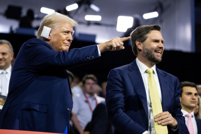 former-president-donald-trump-and-his-vice-presidential-pick-jd-vance-are-seen-during-the-second-night-of-the-republican-national-convention-at-fiserv-forum-in-milwaukee-wis-july-16-2024-franc