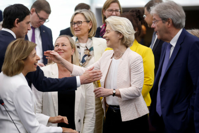 european-commission-president-ursula-von-der-leyen-center-greets-european-commissioners-as-she-arrives-in-the-plenary-of-the-european-parliament-in-strasbourg-eastern-france-thursday-july-18-202