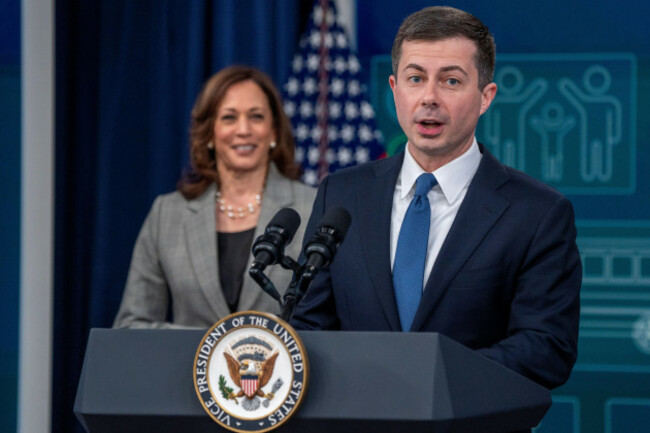 secretary-of-transportation-pete-buttigieg-with-vice-president-kamala-harris-delivers-remarks-during-a-clean-transportation-event-in-the-south-court-auditorium-of-the-white-house-in-washington-dc