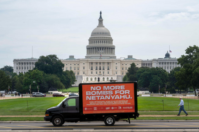 image-distributed-for-oxfam-america-a-pedestrians-walks-past-a-no-more-bombs-for-netanyahu-mobile-billboard-near-the-capitol-building-on-tuesday-july-23-2024-in-washington-oxfam-america-win-with