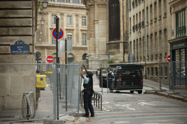 a-police-officer-attaches-fences-at-the-security-perimeter-at-the-2024-summer-olympics-sunday-july-21-2024-in-paris-france-ap-photothomas-padilla