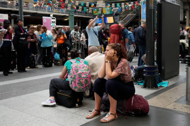 a-traveler-waits-inside-the-gare-du-nord-train-station-at-the-2024-summer-olympics-friday-july-26-2024-in-paris-france-hours-away-from-the-grand-opening-ceremony-of-the-olympics-high-speed-rail