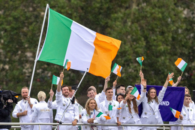 the-irish-team-pass-by-with-flag-bearer-shane-lowry-during-the-opening-ceremony-of-the-paris-2024-olympics