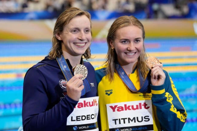 gold-medalists-katie-ledecky-of-the-u-s-left-and-bronze-medalist-ariarne-titmus-of-australia-celebrate-during-the-medal-ceremony-for-the-womens-800m-freestyle-at-the-world-swimming-championships-i